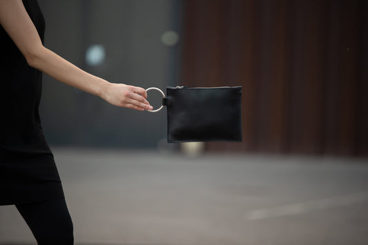 PYKOK Nina black leather clutch with metal ring handle